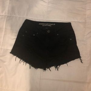 American Eagle ripped black shorts size 4.